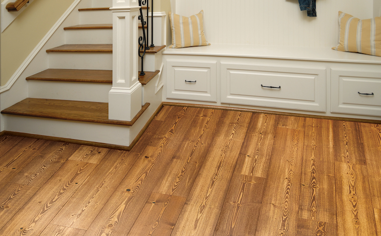 warm toned hardwood flooring in an entryway